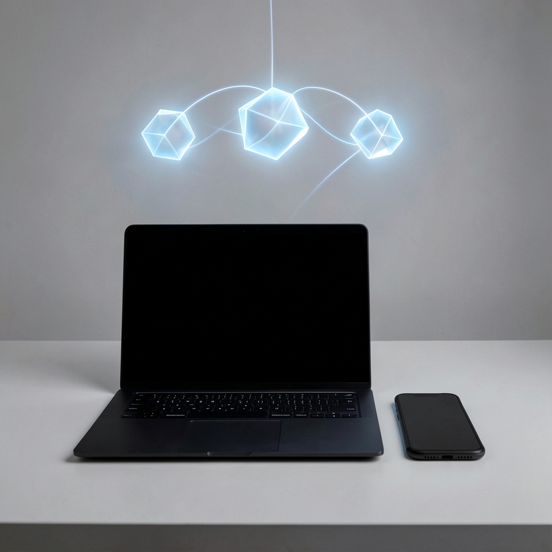 An unbranded dark-screen laptop and phone beneath three connected glowing blue cubes